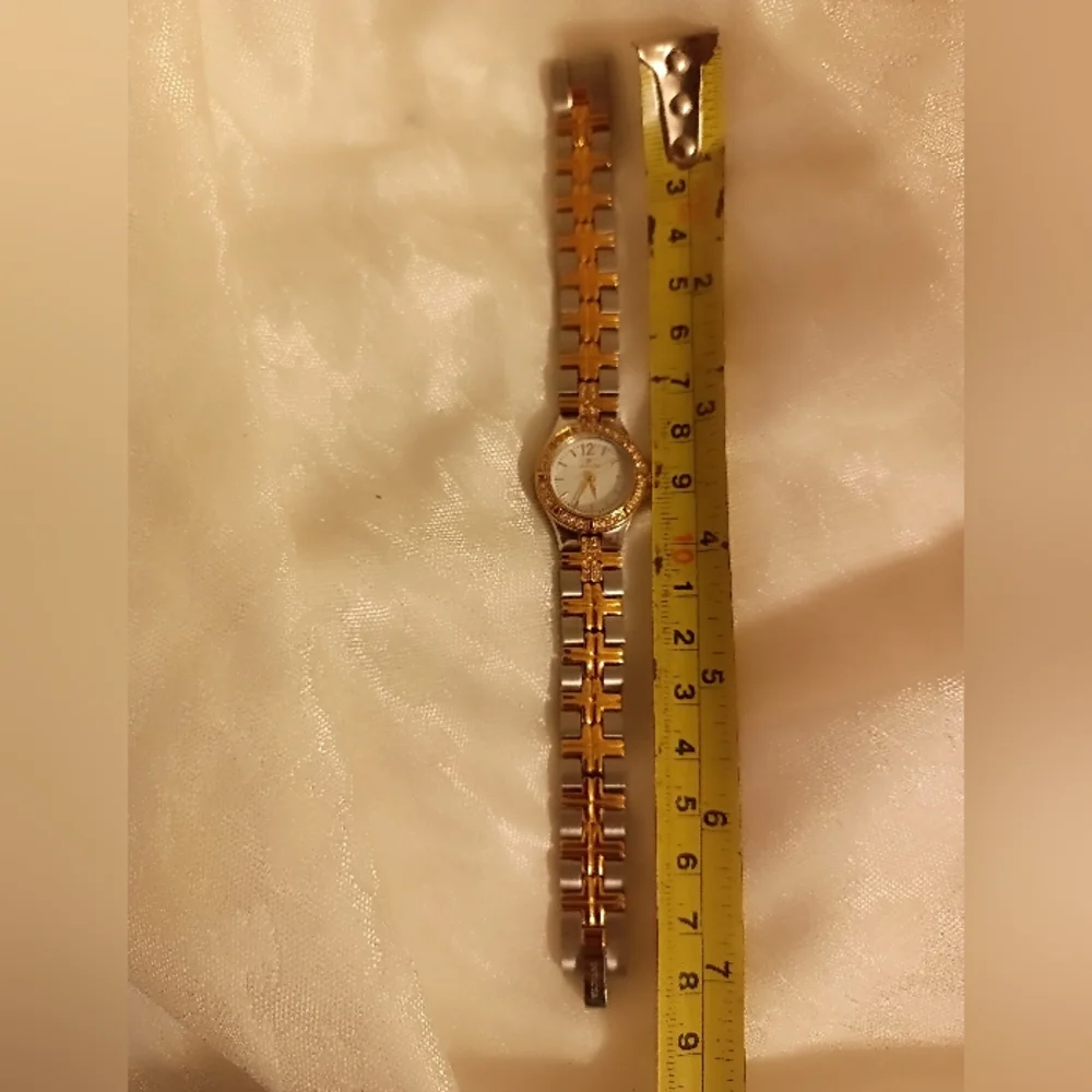 Invicta Wildflower model 0127 gold and silver tone rhinestone